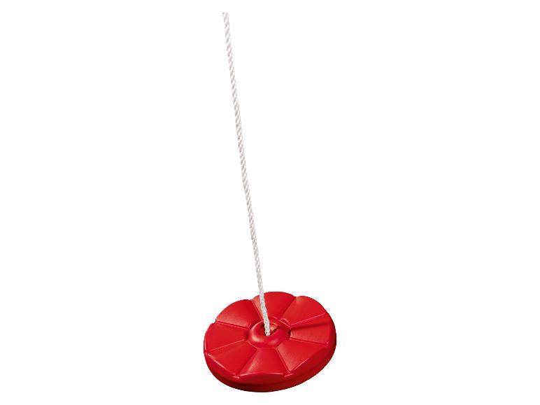 Une balançoire rouge avec une corde.