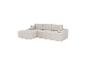 Canapé d'angle modulaire beige avec coussins, revêtu de velours côtelé.