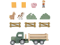 Ensemble de jeu de ferme en bois avec camion, animaux, clôtures et buissons.
