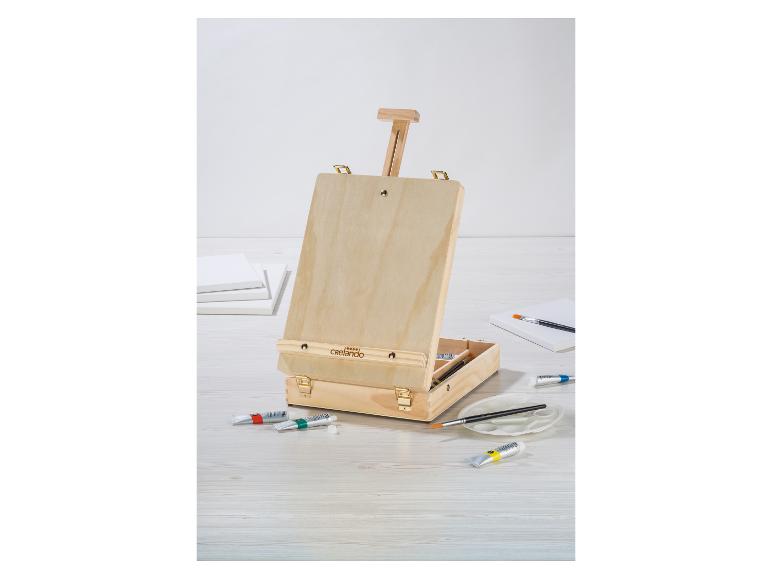Un chevalet de table Crelando en bois avec boîte de peinture.