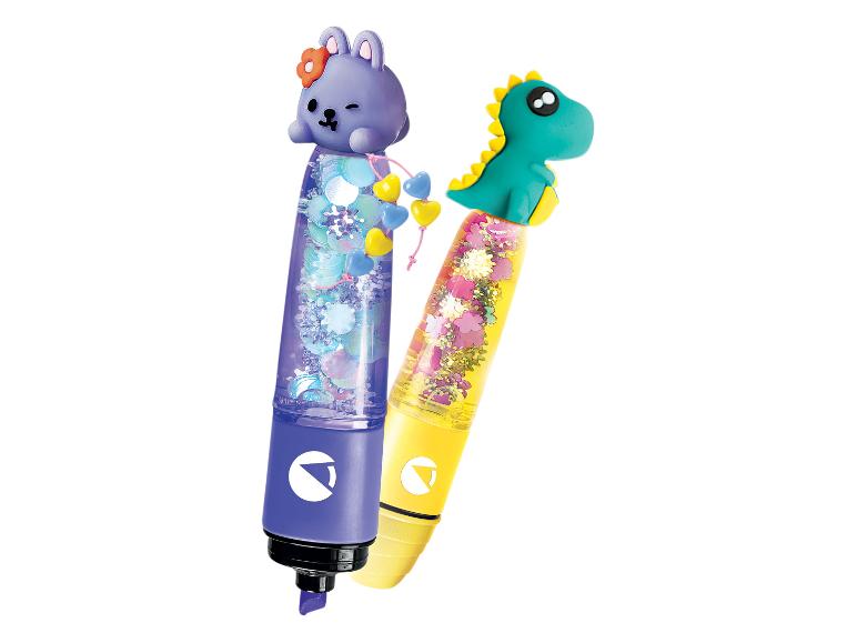 Deux stylos à paillettes, l'un avec un lapin violet et l'autre avec un dinosaure vert.