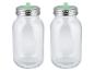 Deux bouteilles en verre transparent avec couvercles métalliques et becs verts.