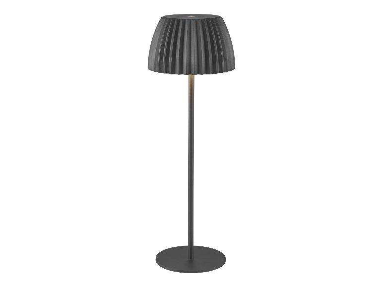 Lampadaire moderne avec abat-jour plissé noir et base ronde.