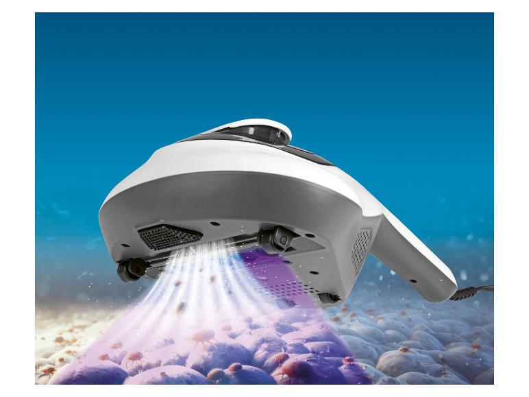 Aspirateur nettoyant les acariens d'une surface avec lumière UV.