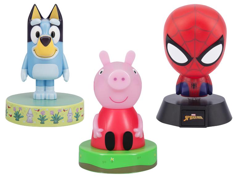 Trois veilleuses personnages : un chien bleu, un cochon rose et un masque de super-héros rouge.