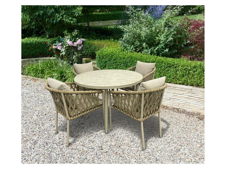 Ensemble de jardin avec table ronde et quatre chaises coussinées sur un chemin de gravier.