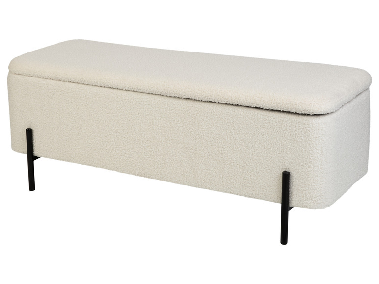 Un banc de rangement blanc avec des pieds noirs