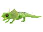 Un jouet de reptile vert avec une gueule éclairée