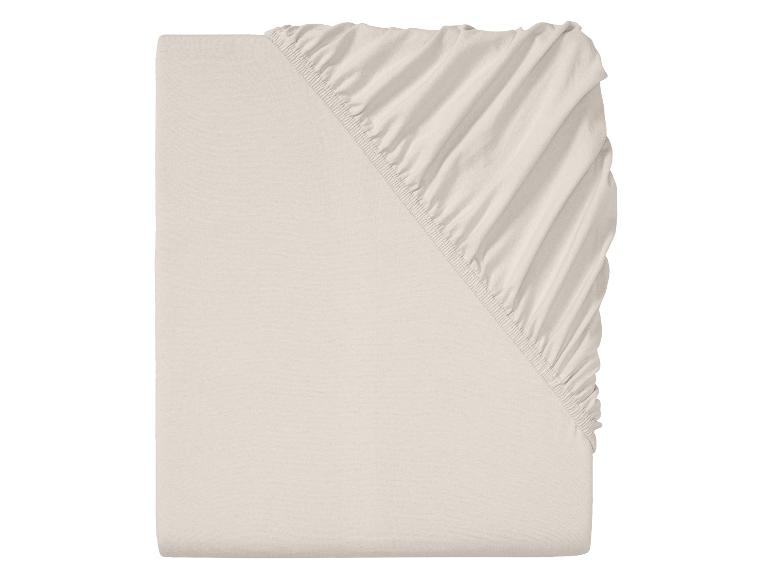 Drap-housse beige clair, plié