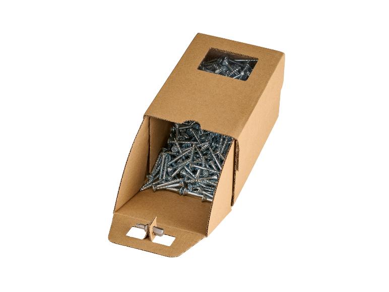 Boîte en carton avec des vis et un embout de tournevis.