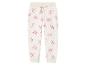 Jogging crème enfant, motif nœuds roses.