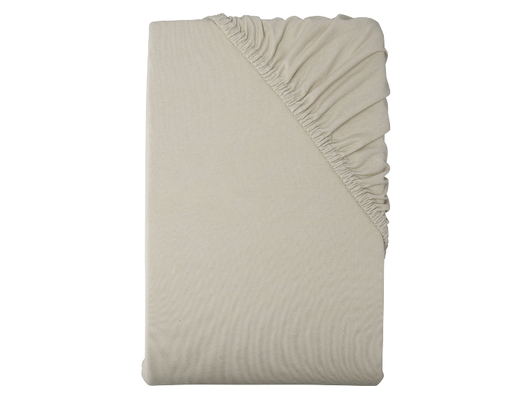 Drap-housse beige en coton bio.