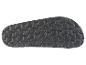 Semelle de sandale noire avec motif texturé.
