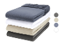 Ensemble de draps en jersey de coton en quatre couleurs.