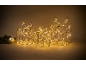 Trois cadeaux lumineux de Noël en fil métallique avec des lumières LED chaudes.