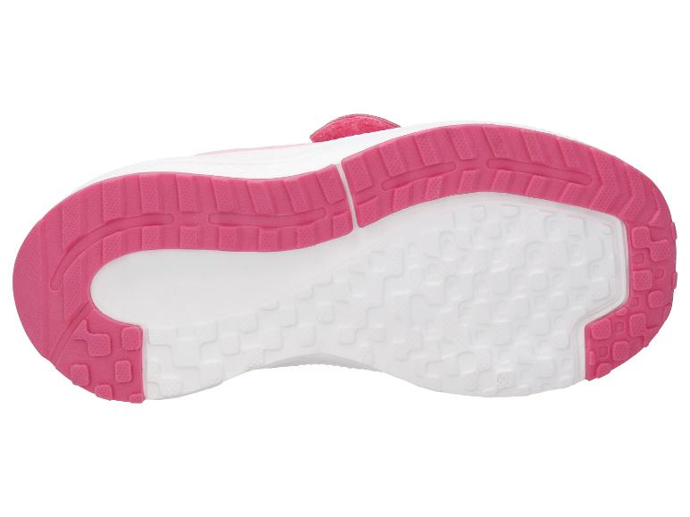 Semelle rose et blanche d'une chaussure de sport pour enfant avec un motif antidérapant texturé.