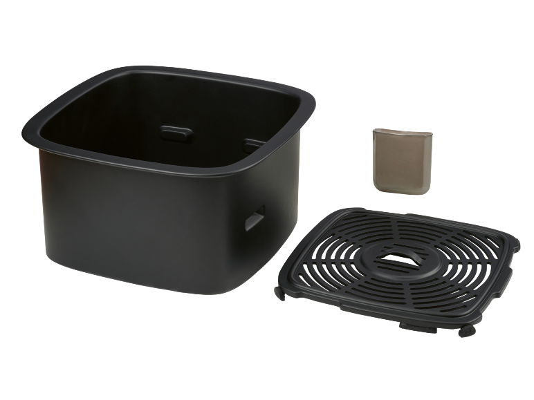 Panier de friteuse à air avec plaque de cuisson amovible et petit accessoire.