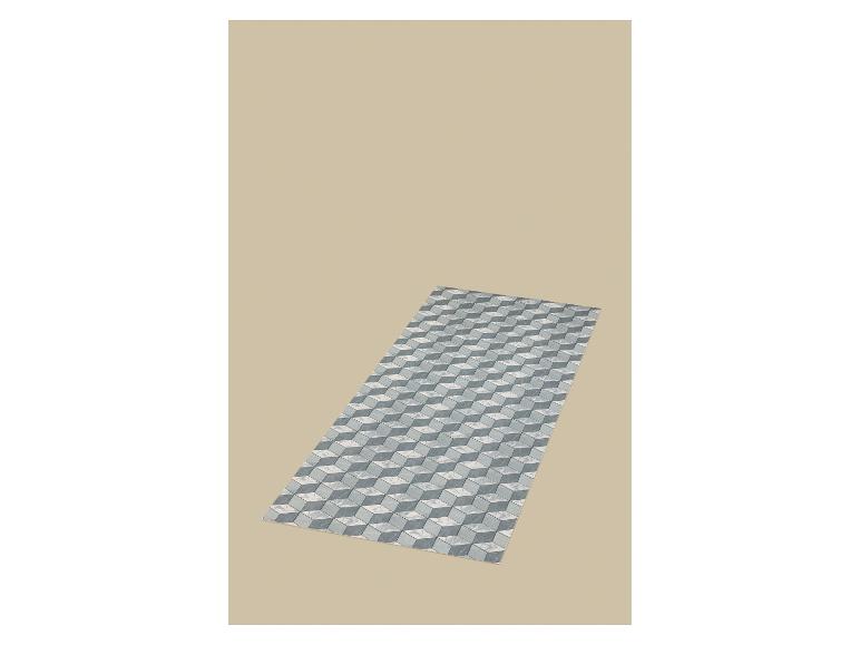 Tapis avec motif de cubes 3D en nuances de gris et blanc sur fond beige.