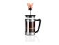 Une cafetière à piston en acier avec du café