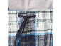 Pantalon de pyjama à carreaux avec cordon de serrage à la taille et un t-shirt gris.