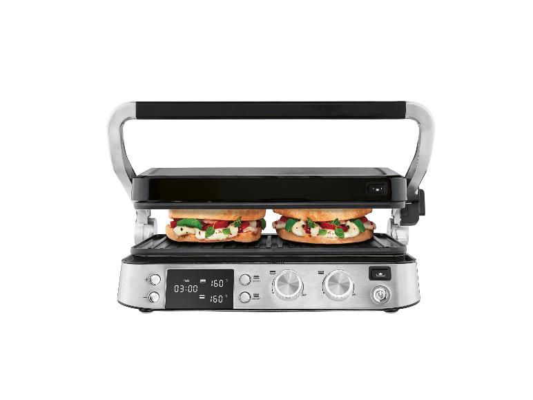 Un grill en acier inoxydable avec deux sandwichs, affichant une minuterie et des réglages de température.