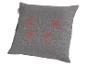 Coussin de massage gris avec quatre points lumineux rouges et étiquette Sensiplast