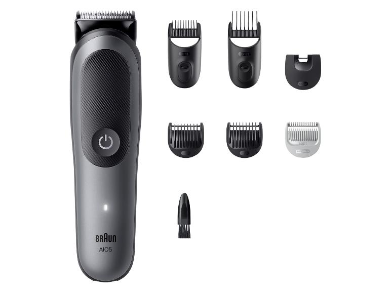 Tondeuse à cheveux et à barbe avec divers accessoires et peignes.