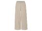 Pantalon large beige en tissu texturé.