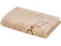 Serviette beige pliée avec broderie de renne