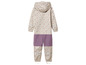 Combinaison de pluie pour enfant beige à imprimé feuilles.