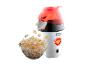 Du pop-corn dans un bol, à côté d'une machine à pop-corn blanche Russell Hobbs.