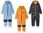 Trois combinaisons de ski pour enfants avec des motifs d'animaux.
