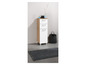 Une armoire de salle de bain blanche avec deux tiroirs et une porte, un panier noir et un tapis gris.