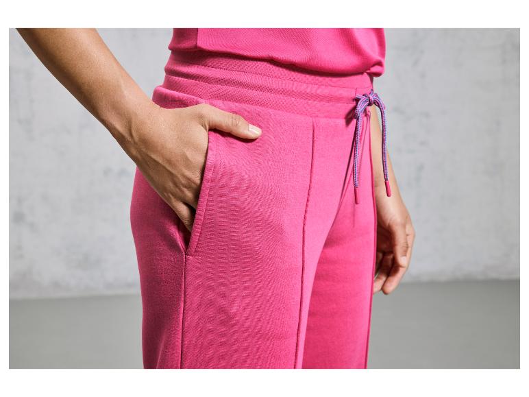 Pantalon de jogging rose avec cordon et poches.