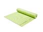 Tapis de yoga vert JETTESPORT, partiellement roulé, avec une surface texturée.