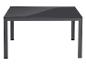 Table gris foncé avec plateau brillant sur fond blanc.