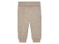 Pantalon beige en tissu chiné pour bébé.