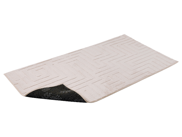 Un tapis de bain beige avec un motif géométrique.