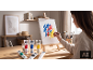 Une jeune fille peint sur une toile avec des peintures acryliques colorées.