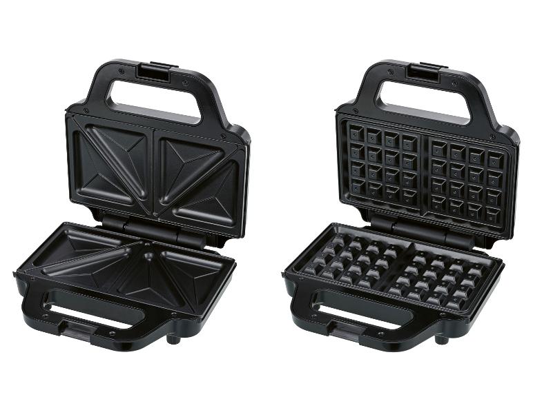 Gaufrier et appareil à croque-monsieur noirs ouverts, montrant les plaques interchangeables.