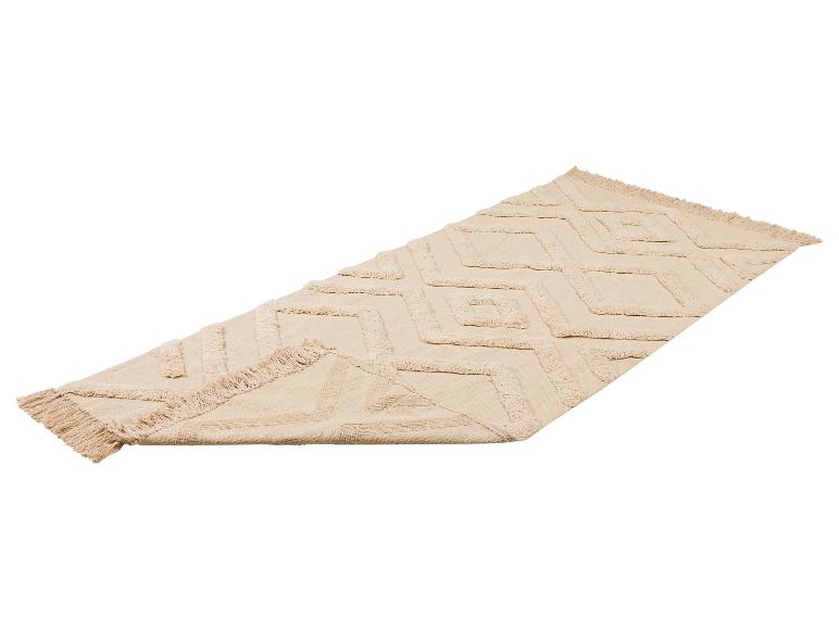 Tapis beige avec motif géométrique en losanges et franges