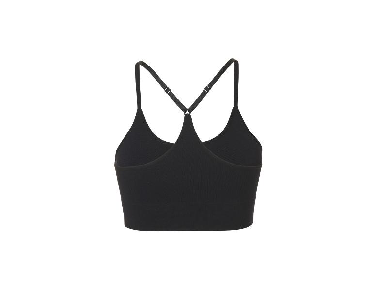 Haut de sport noir côtelé avec bretelles croisées dans le dos.