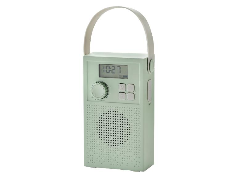 Radio portable vert menthe avec affichage numérique et poignée de transport.