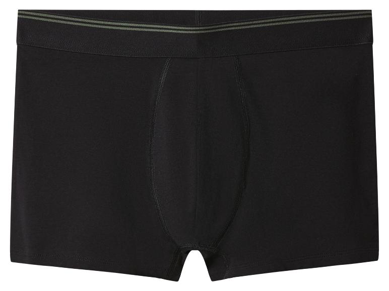 Caleçon boxer noir pour homme avec des rayures vertes sur la ceinture.