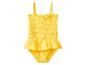 Maillot de bain jaune pour enfant avec volants et détails smockés.