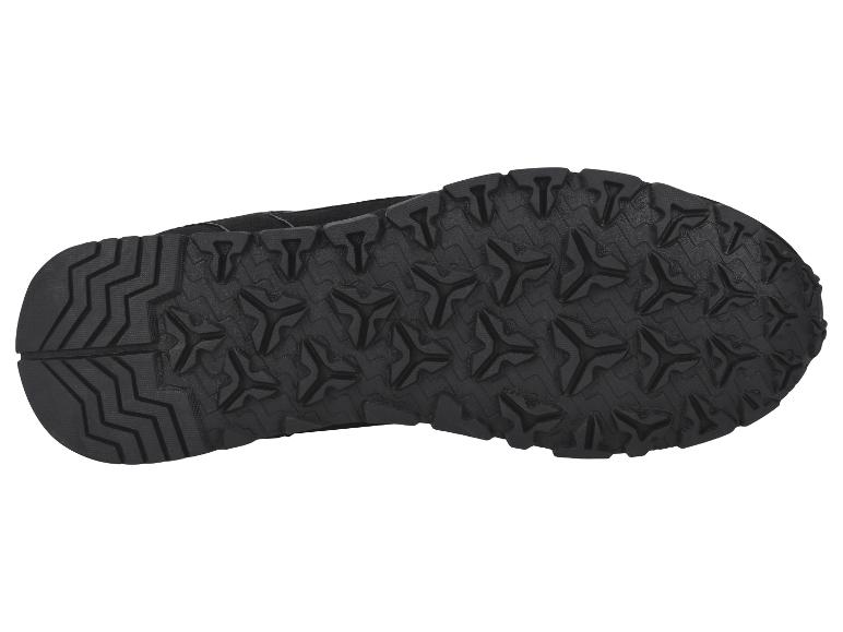 Semelle d'une chaussure de sport noire avec motif de bande de roulement