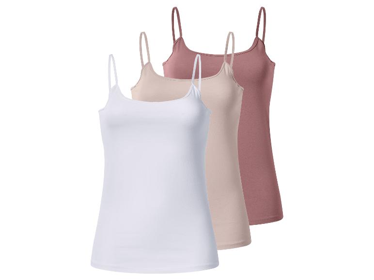 Lot de trois débardeurs femme à fines bretelles en blanc, beige et rose.