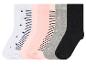 Six paires de chaussettes à pois, à rayures et unies.