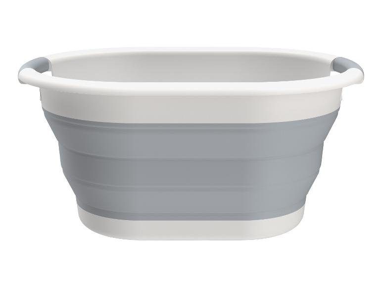 Un panier à linge pliable gris avec des poignées blanches.