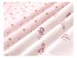 Tissu enfant avec motif étoiles et astronautes.